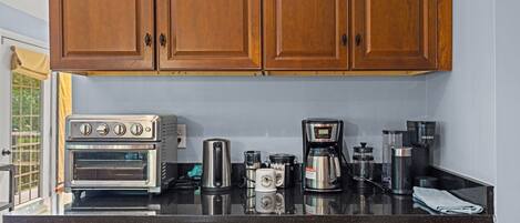 Coffee/tea maker, fridge, microwave, oven