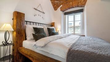 Deluxe Suite, Ground Floor | Minibar, in-room safe, individually decorated, soundproofing