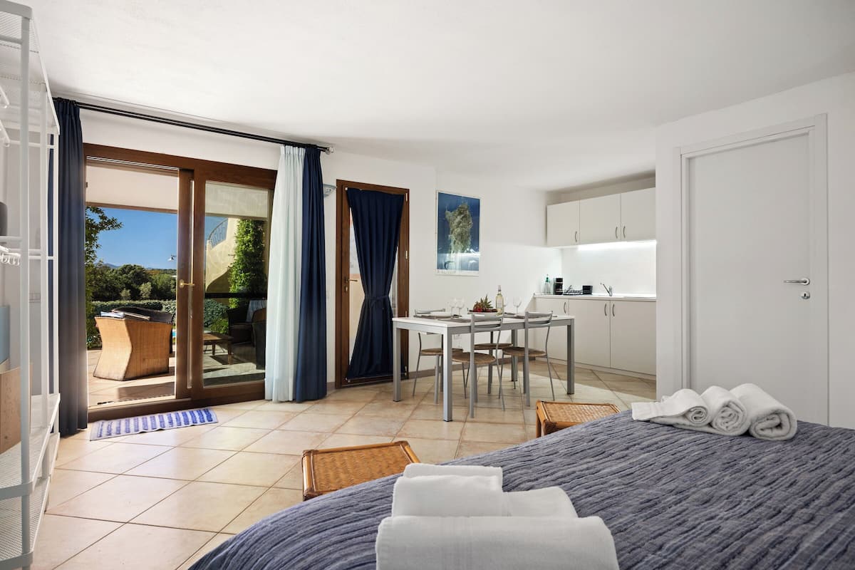 Comfort Room, Pool View | Minibar, individually furnished, blackout drapes, iron/ironing board
