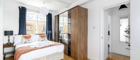 1 bedroom, desk, iron/ironing board, travel crib