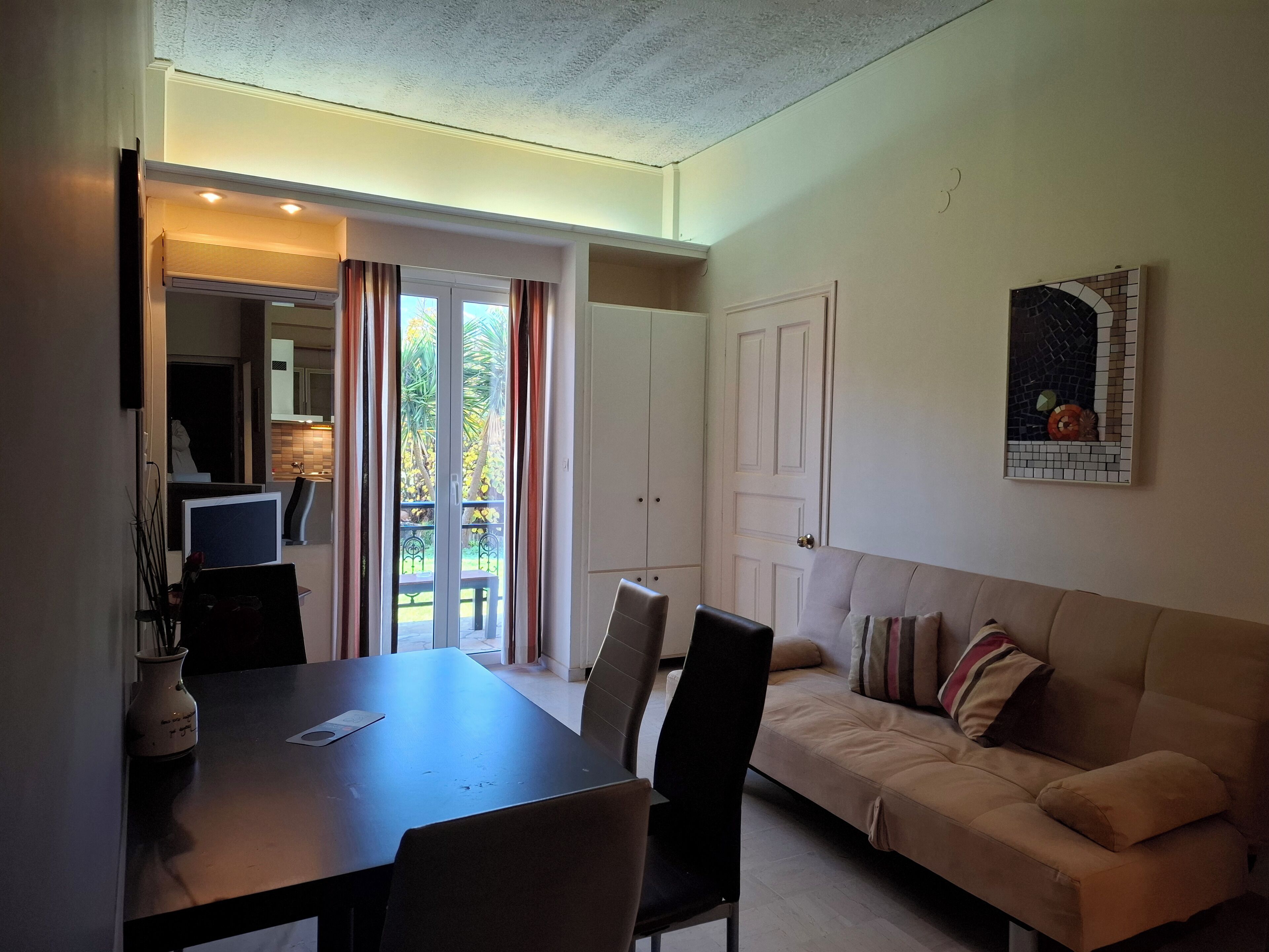 Apartment, 1 Bedroom, Patio | Living area | 32-inch flat-screen TV with digital channels