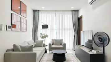 Premier Suite, 2 Bedrooms, City View, Poolside | Living area | 65-inch Smart TV with premium channels, fireplace, Netflix