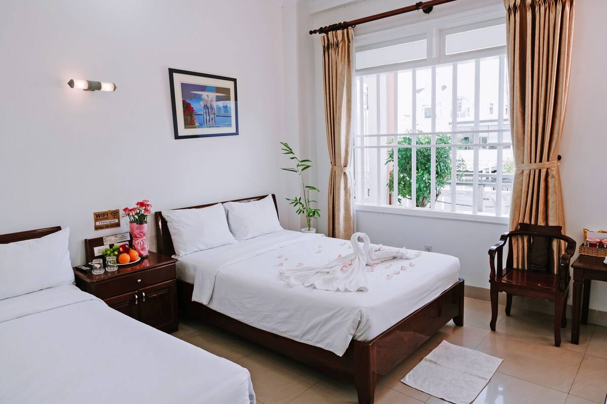 Superior Quadruple Room, City View | In-room safe, desk, laptop workspace, blackout drapes