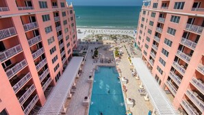 A high-rise hotel with a pool and beach view. - Unforgettable Luxury at Hyatt Clearwater Beach! (Clearwater Beach)