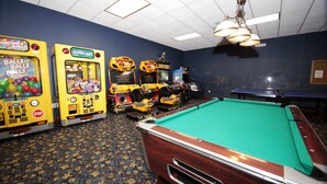 A pool table in a room with arcade games and a patterned carpet. - Paradise 4Bd w Private Pool Waterpark 8951 (Kissimmee)