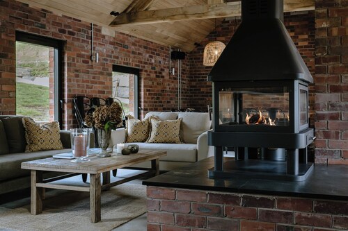 Nestled in a serene Welsh valley, this unique mill conversion blends historic charm with modern comfort offering inviting spaces for memorable family gatherings or inspiring corporate away days.