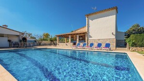 A clear blue pool with lounge chairs and a covered patio area. - Finca Can Daniel, pool, A/C, Wifi, close to the beach 4 km, quiet location, 3 bedrooms. (Pollenca)