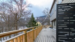 A wooden deck with a view of a mountain and trees. - 6 Village Edge 2 Bedroom Condo (Warren)