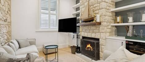 Smart TV, fireplace, books