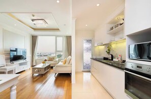 Presidential Suite, 2 Bedrooms, City View, Poolside | Living area | 65-inch Smart TV with cable channels, fireplace, Netflix - Kotrip Luxury Vacation Le'man Residence (Thanh pho Ho Chi Minh)