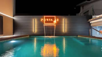 Outdoor pool, open 8:00 AM to 10:00 PM, pool umbrellas, pool loungers