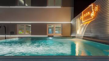 Outdoor pool, open 8:00 AM to 10:00 PM, pool umbrellas, pool loungers