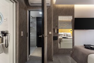 Deluxe Studio Suite, Pool View | In-room safe, desk, laptop workspace, blackout drapes