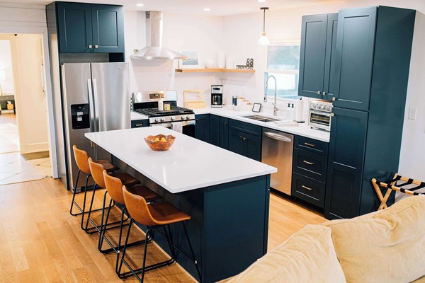 This open, airy space makes family time effortless—kids at the counter, parents prepping a meal, conversations flowing from kitchen to dining room. It’s a welcoming place for connection and everyday joy.