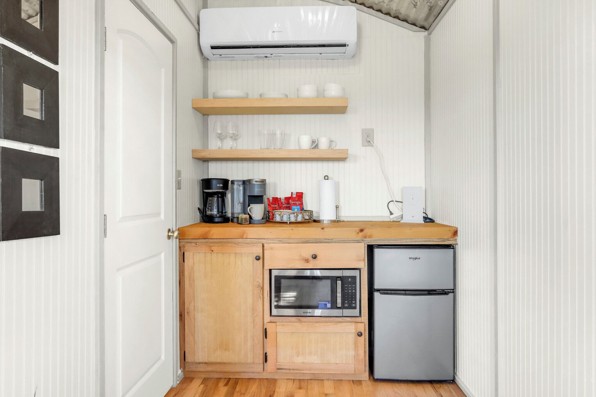 Fridge, microwave, coffee/tea maker, cookware/dishes/utensils