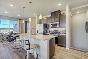Fridge, microwave, oven, stovetop - NEW Modern Interquest Stay • King Bed • Balcony (Colorado Springs)