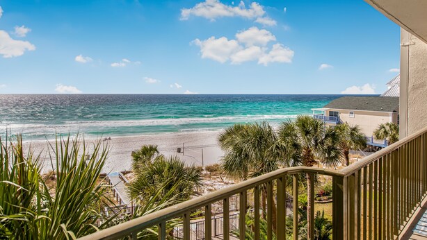 A balcony with a view of a beach and ocean. - Beachfront Comfort | 3BR/3BA | 4th Floor | Quiet East End **BEACH CHAIRS (Panama City Beach)