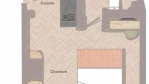 Plan d’étage d’une chambre d’hôtel avec indication des différentes zones : une cuisine, une salle de bain et une chambre.