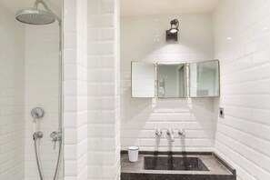 Shower, hair dryer - A French Chic 1-Bedroom Apartment in Saint Germain (Paris)