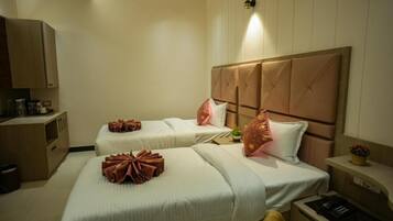 Deluxe Twin Room | Desk, laptop workspace, iron/ironing board