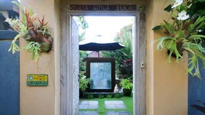 A doorway with a sign reading "Villa Suka Suka" and a plaque indicating "Perda I.M.B. No.53 TH.2011". - Hibiscus/Upper Suite/Ubud/Pool/AC (Bali)