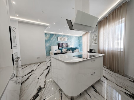 Fridge, microwave, oven, stovetop. Blu Sky 2 bedroom apartment