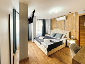 Suite Deluxe | Caja fuerte, cortinas opacas, tabla de planchar con plancha