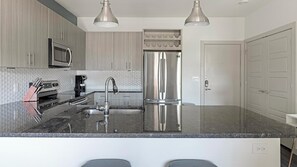 Fridge, dining tables - Landing | Modern 1BD, Gym, Pool (Allen)