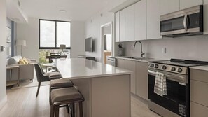 Fridge, dining tables - Landing | Stylish 2BD, Yoga Studio, Clubhouse (North Miami)
