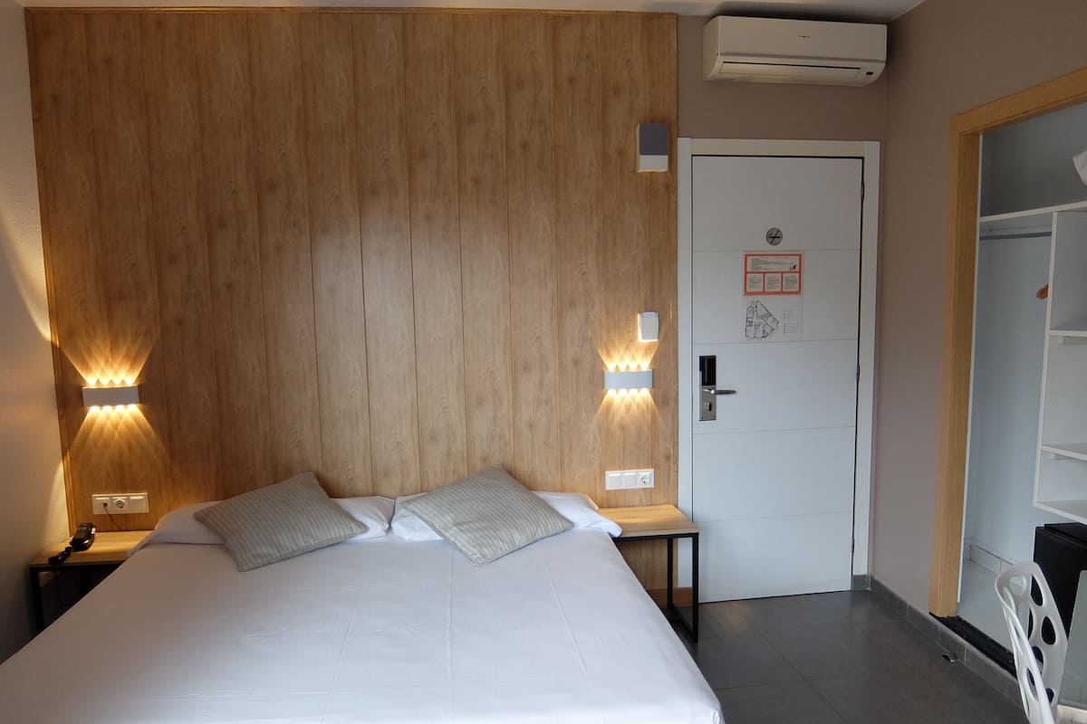 Standard Double Room, Balcony, City View | Down comforters, minibar, in-room safe, desk