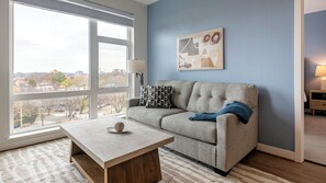 Apartment (1 Bedroom) | Living area | 50-inch TV with digital channels - Landing Furnished Apartments - Alexandria (Alexandria)