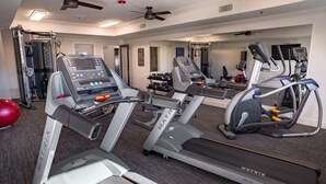 A gym with treadmills, a stationary bike, and free weights. - Landing | Spectacular 2BD, Clubhouse, Pool (Grand Prairie)