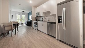 Fridge, dining tables - Landing | Chic 1BD, Pool, Gym (Austin)