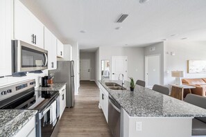 Fridge, dining tables - Landing | Modern 2BD, Gym, Pool (Palm Bay)