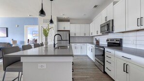 Fridge, dining tables - Landing | Stylish 2BD, Pool, Yoga Studio (Buford)