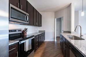 Fridge, dining tables - Landing | Chic 2BD, Game Room (Daytona Beach)