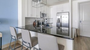 Fridge, dining tables - Landing | Chic 1BD, Clubhouse, Gym (The Woodlands)