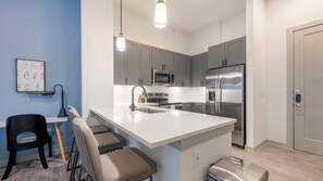 Fridge, dining tables - Landing | Spectacular 1BD, Rooftop Lounge, Pool (Austin)