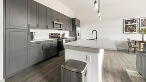 Fridge, dining tables - Landing | Beautiful 1BD, Rooftop Lounge, Game Room (Austin)