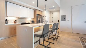 Fridge, dining tables - Landing | Chic 1BD, Gym, Yoga Studio (San Antonio)