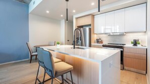 Fridge, dining tables - Landing | Modern 1BD, Yoga Studio, Gym (San Antonio)