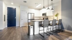 Fridge, dining tables - Landing | Beautiful 1BD, Yoga Studio, Gym (Colorado Springs)