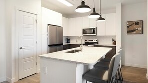 Fridge, dining tables - Landing | Chic 2BD, Gym, Clubhouse (Colorado Springs)