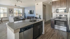 Fridge, dining tables - Landing | Modern 2BD, Pool, Courtyard (Houston)