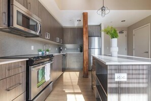 Fridge, dining tables - Landing | Chic 1BD, Gym, Courtyard (New Haven)