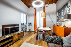 Apartamento, 1 quarto, terraço | Área de estar