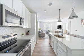 Fridge, dining tables - Landing | Chic 2BD, Yoga Studio, Pool (Orange Beach)