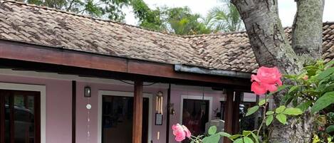 A building with a tiled roof and a brick foundation.