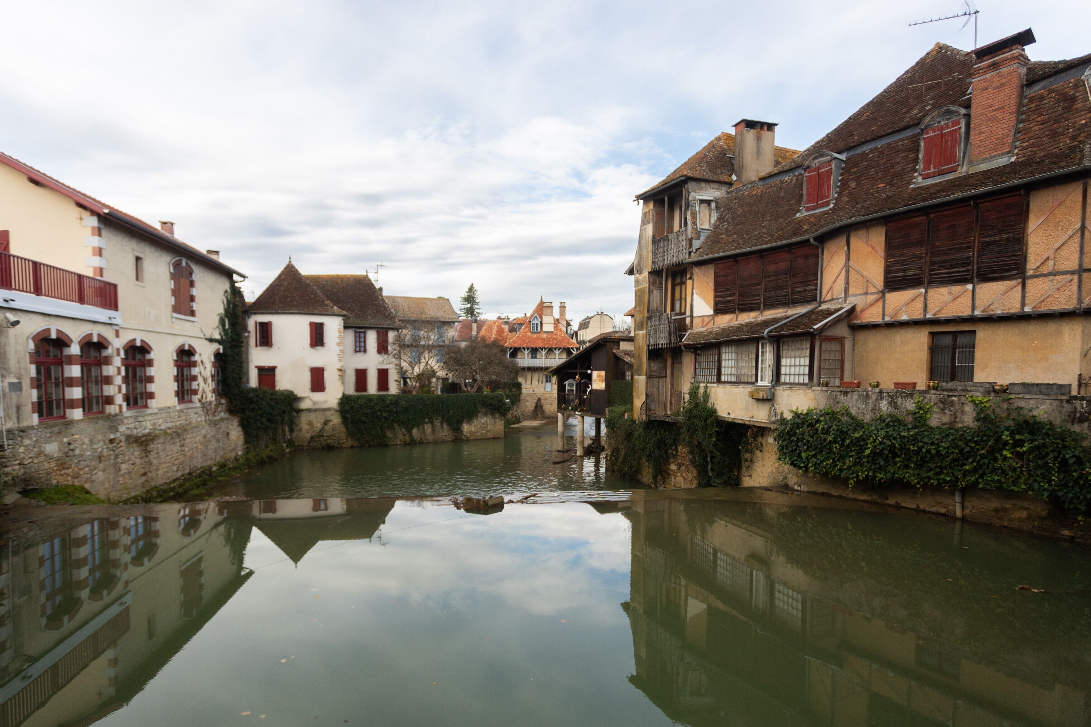 A narrow waterway with buildings on either side.