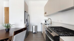Fridge, dining tables - Landing | Stunning 2BD, Pool, Gym (Enterprise)